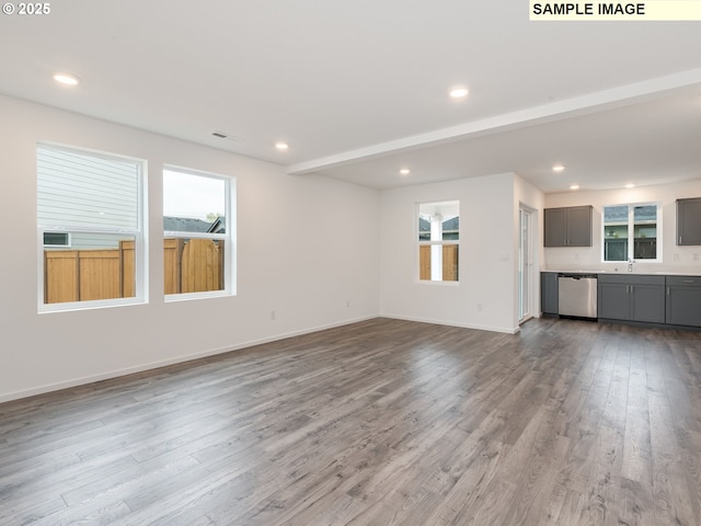 5506 NE 66th Pl, Vancouver, WA 98661 - unfurnished living room with baseboards, a wealth of natural light, recessed lighting, and wood finished floors