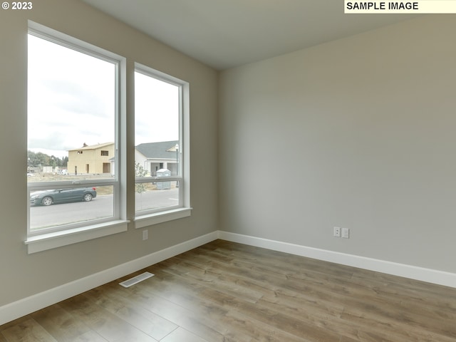 empty room featuring hardwood / wood-style floors