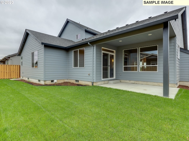 rear view of property featuring a patio area and a yard