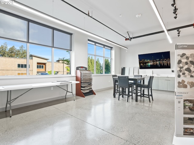 dining room featuring track lighting