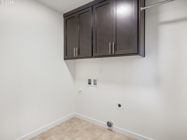 laundry area with washer hookup, cabinets, hookup for a gas dryer, and hookup for an electric dryer