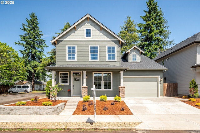 902 E 30th St, Vancouver, WA 98663 - craftsman-style house featuring a porch, an attached garage, driveway, a shingled roof, and stone siding