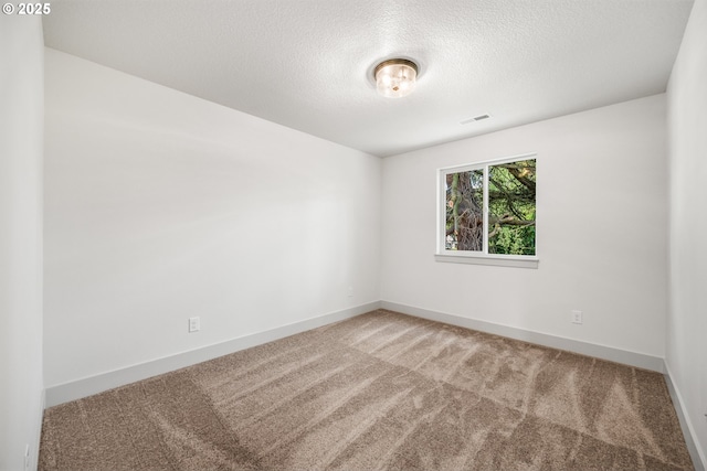 902 E 30th St, Vancouver, WA 98663 - carpeted spare room featuring a textured ceiling and baseboards