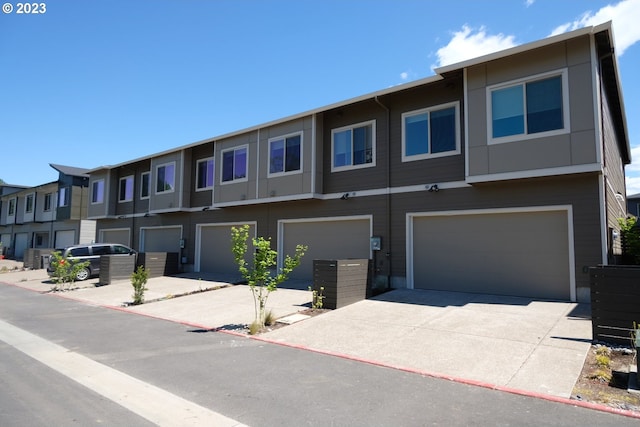 multi unit property featuring a garage