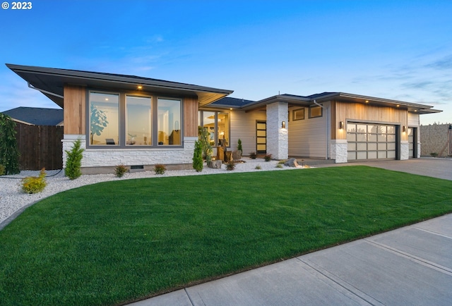 view of front facade with a front yard and a garage