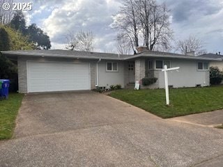 1427 SE 109th Ave, Portland, OR 97216 - single story home with driveway, a garage, and a front yard
