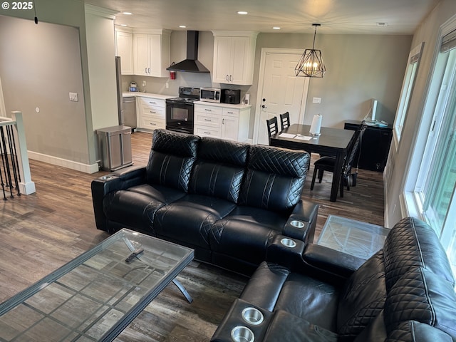 1427 SE 109th Ave, Portland, OR 97216 - living area featuring dark wood-style floors, baseboards, recessed lighting, and a chandelier