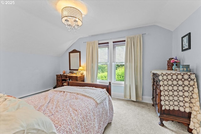 5850 SW Vermont St, Portland, OR 97219 - bedroom featuring vaulted ceiling, light colored carpet, a chandelier, and baseboards