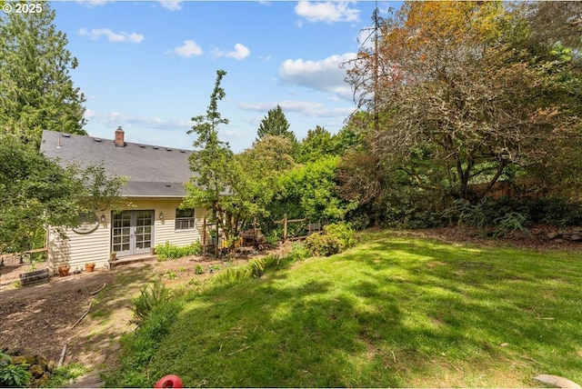 5850 SW Vermont St, Portland, OR 97219 - view of grassy yard with french doors