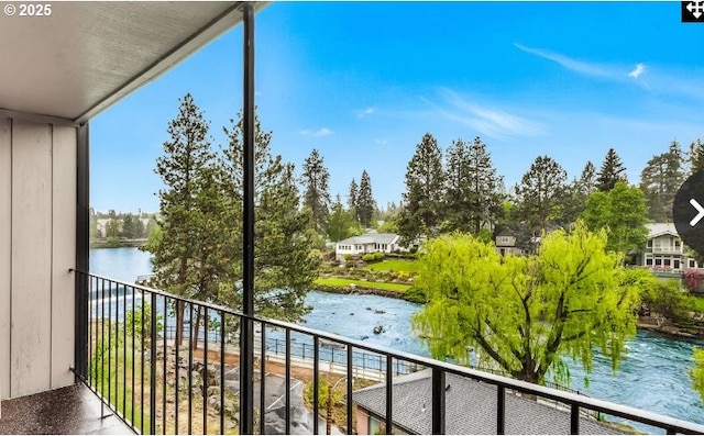 balcony featuring a water view