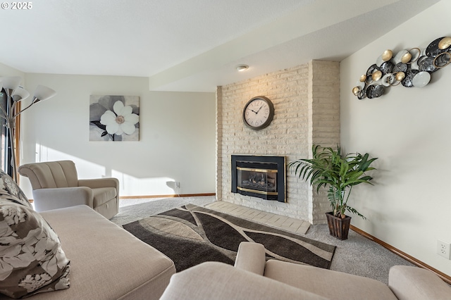 living room featuring carpet flooring and a fireplace