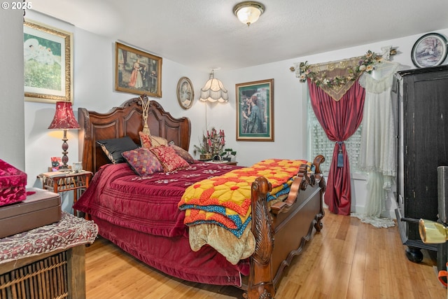 11215 NE 359th St, La Center, WA 98629 - bedroom featuring wood finished floors and multiple windows