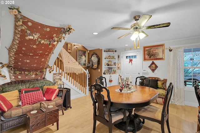 dining room with recessed lighting, stairway, light wood-style flooring, and a ceiling fan