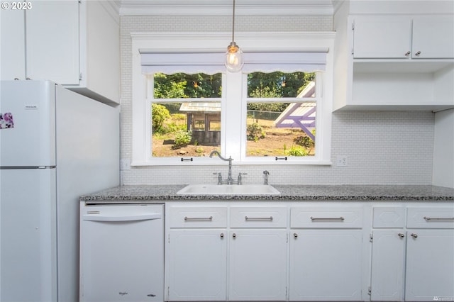 kitchen featuring white appliances, light stone counters, and white cabinetry