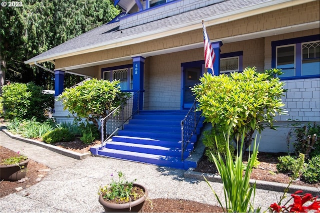 view of exterior entry featuring a porch