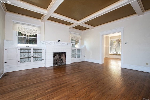 unfurnished living room with dark wood-type flooring, a wealth of natural light, and a brick fireplace