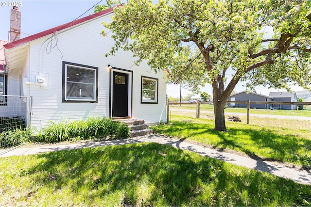 2604 15th St, Baker City, OR 97814 - view of front facade with a front lawn, a chimney, and entry steps