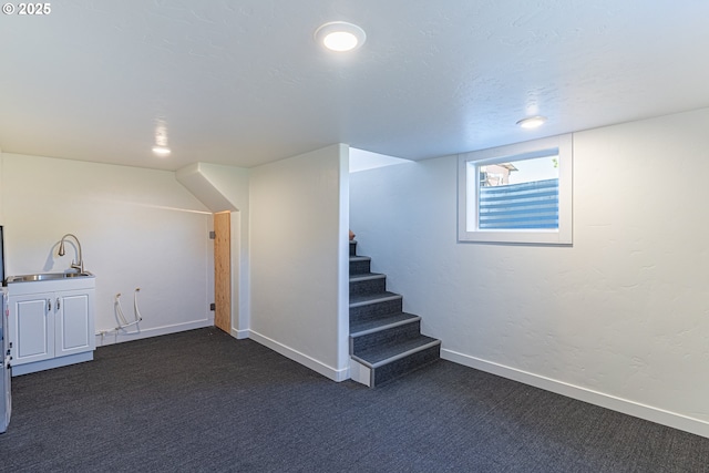 2604 15th St, Baker City, OR 97814 - basement with a sink, dark carpet, stairs, and baseboards