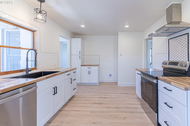2604 15th St, Baker City, OR 97814 - kitchen featuring butcher block countertops, appliances with stainless steel finishes, a sink, and recessed lighting