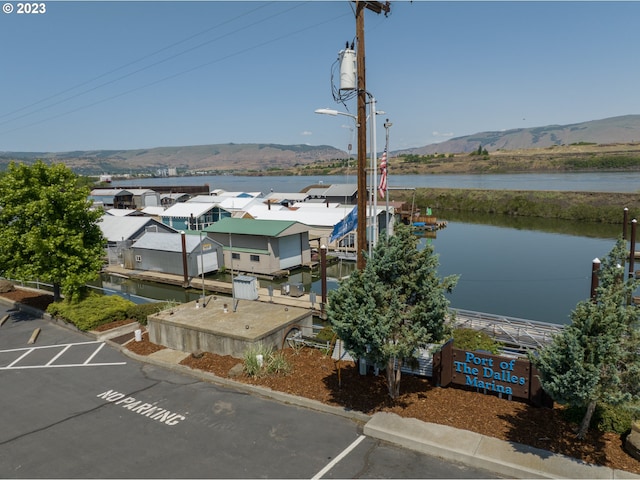 water view with a dock and a mountain view