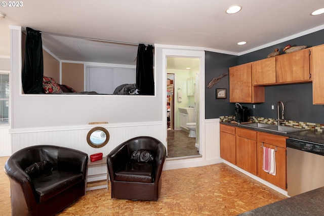 kitchen featuring light tile floors, crown molding, dishwasher, and sink