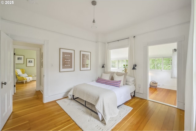 2147 NE 14th Ave, Portland, OR 97212 - bedroom featuring light wood finished floors and baseboards
