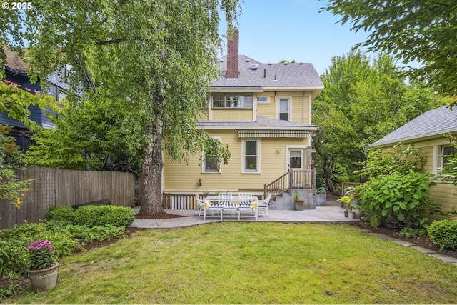 2147 NE 14th Ave, Portland, OR 97212 - back of property featuring a patio area, a chimney, and a shingled roof