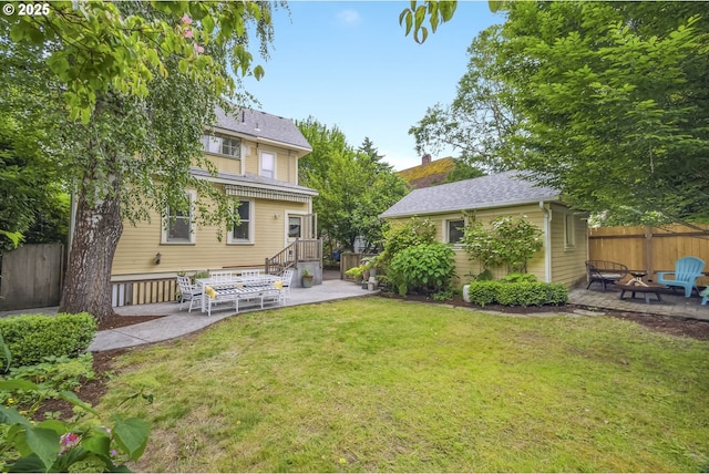 2147 NE 14th Ave, Portland, OR 97212 - back of property with an outdoor fire pit, a patio area, and an outbuilding