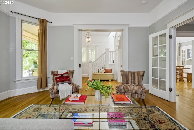 2147 NE 14th Ave, Portland, OR 97212 - sitting room with wood finished floors, stairway, plenty of natural light, and baseboards