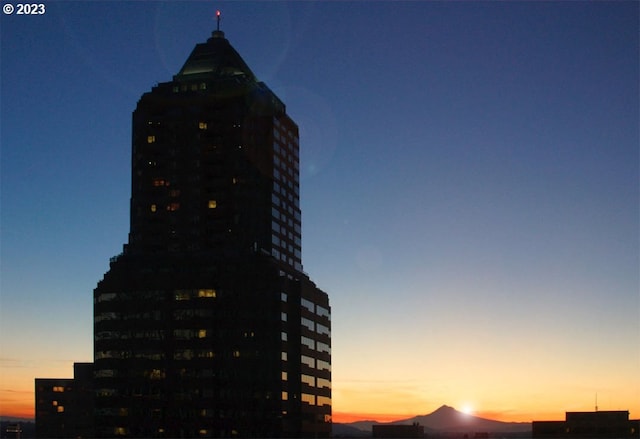 view of outdoor building at dusk