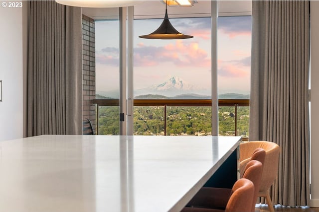 dining room featuring a mountain view