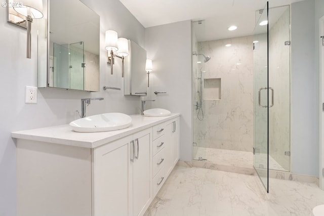 bathroom with double sink vanity, tile floors, and a shower with shower door