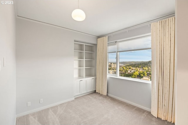 empty room featuring light colored carpet