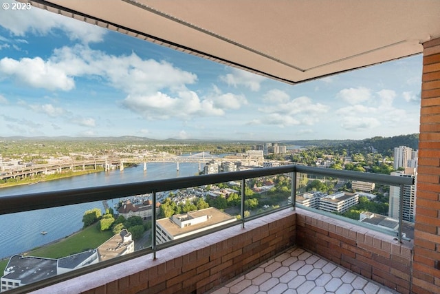 balcony featuring a water view