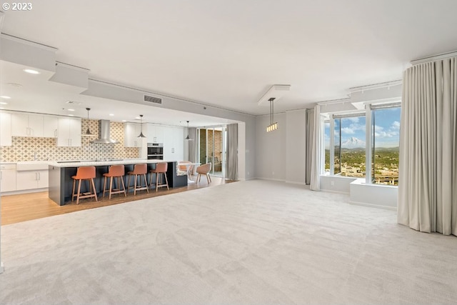 unfurnished living room with light hardwood / wood-style floors