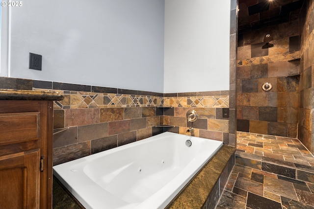 bathroom featuring tile walls and shower with separate bathtub