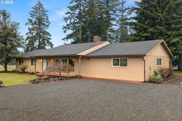 ranch-style home with a front lawn