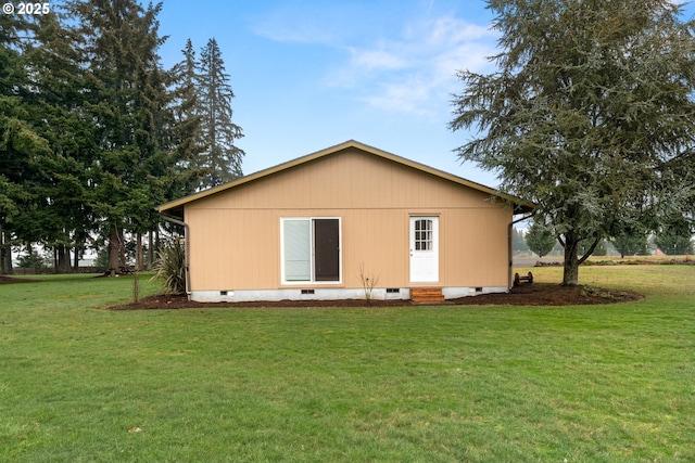 rear view of house with a yard