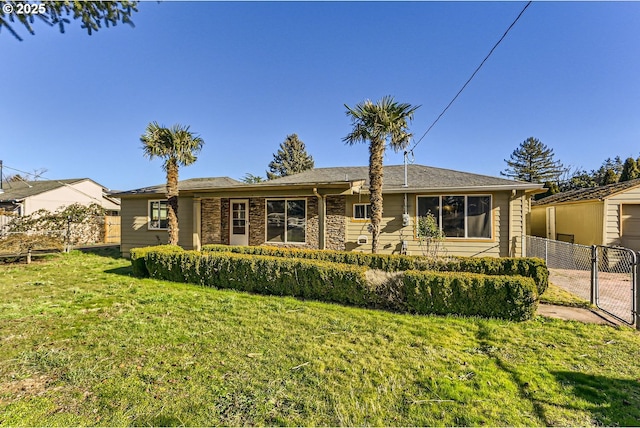 single story home with a front yard