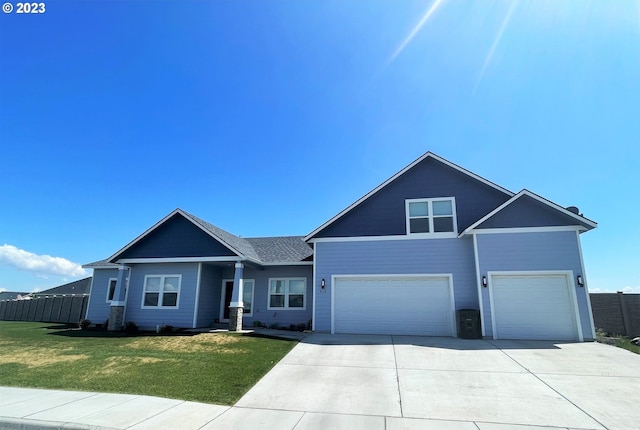 view of front of house featuring a front yard and a garage