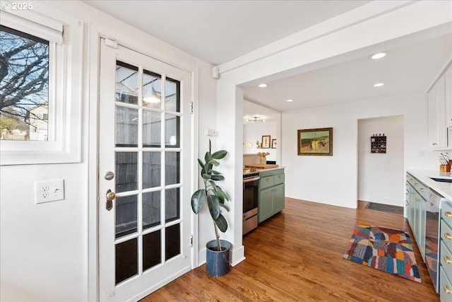 doorway with hardwood / wood-style flooring