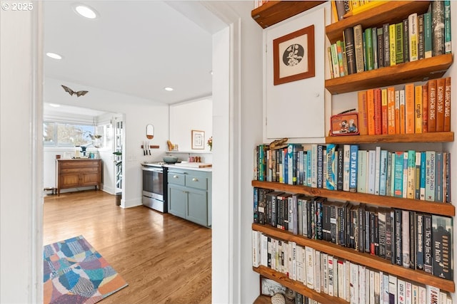 interior space with electric stove and light wood-type flooring