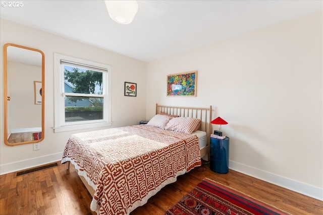 bedroom featuring dark hardwood / wood-style floors