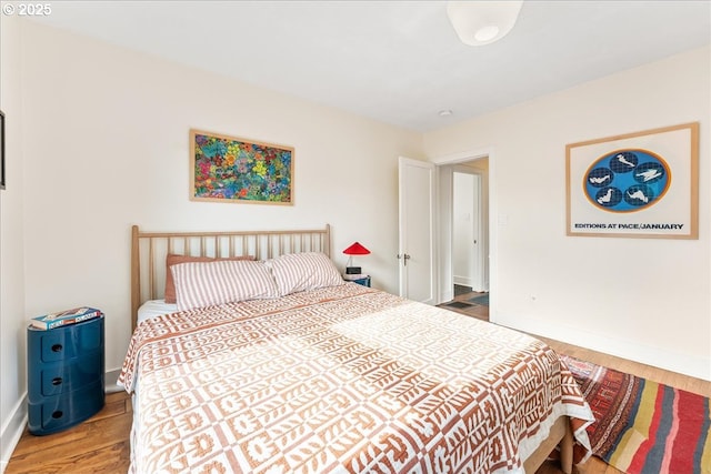 bedroom with wood-type flooring