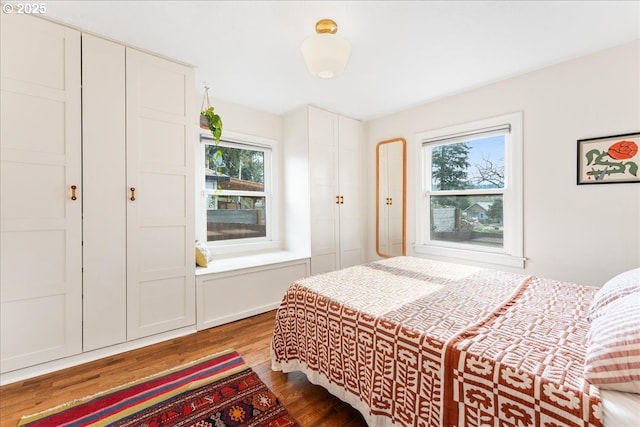 bedroom with hardwood / wood-style floors