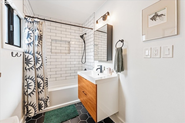 bathroom featuring tile patterned floors, vanity, and shower / tub combo