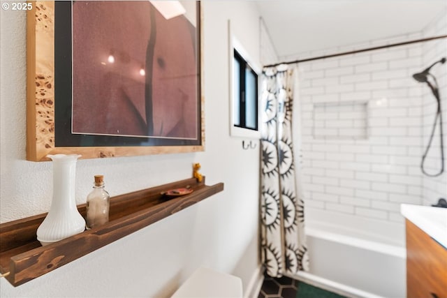 full bathroom featuring vanity, shower / tub combo with curtain, and toilet