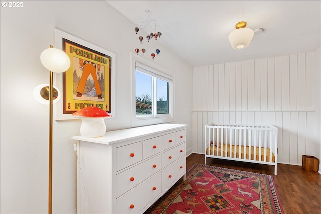 bedroom with dark wood-type flooring