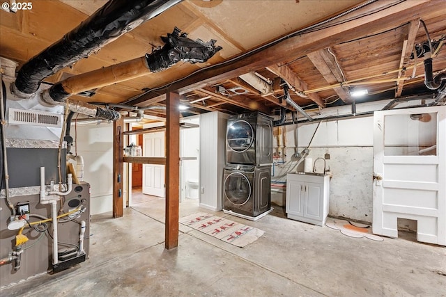 basement with stacked washer / dryer