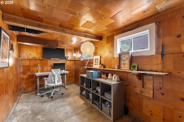 office area with wooden ceiling, wooden walls, and concrete floors